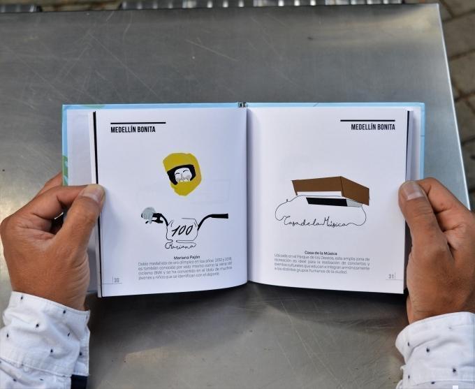 Manos con libro de dibujos